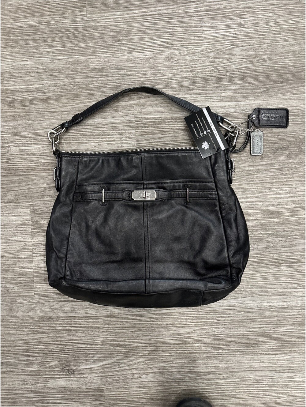 Woman’s Coach Black Leather handbag With Twist Lock